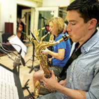 Students play saxophones at WSU recording studio