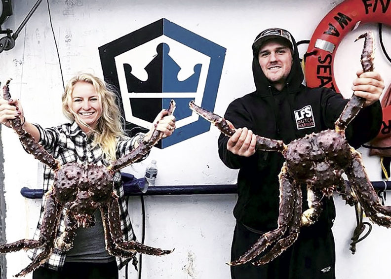 Clark Pederson and Mandy Hansen Pederson hold crabs