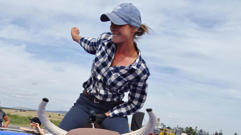 Laura Moore rides the mechanical bull in Spangle