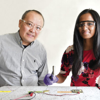 Pizhong Qiao with assistant Ayumi Manawadu show bridge damage sensor