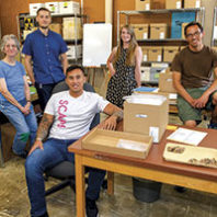 WSU veterans and staff in anthropology archives room
