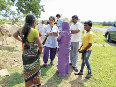 Deepti Singh listens to Indian farmers