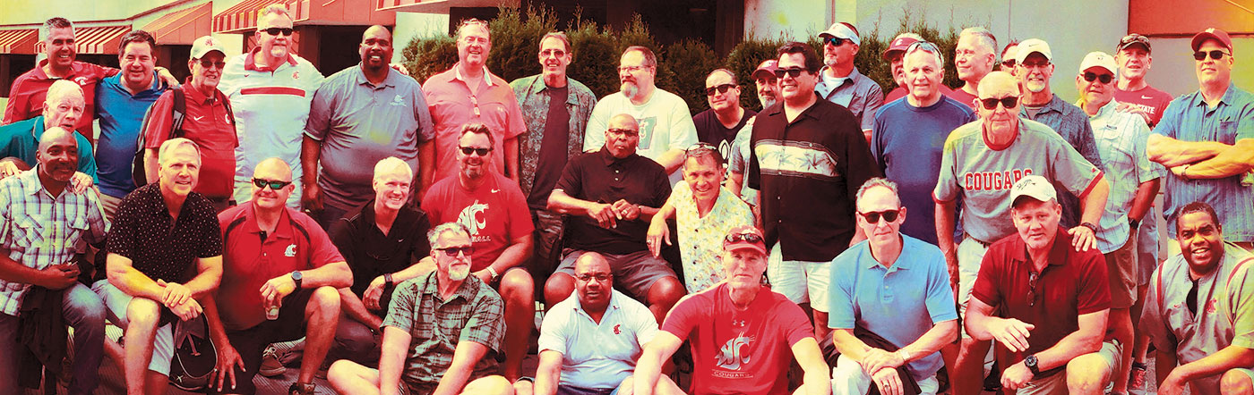 WSU Holiday Bowl team of 1981, including 32 players, four coaches, and the head trainer at a reunion in 2019