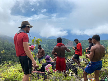 Group of men on top of a mountain in Papua New Guinea