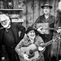 Robert Michael Pyle, Ray Prestegard and Krist Novoselic with guitars