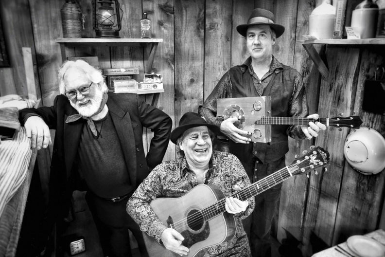 Robert Michael Pyle, Ray Prestegard and Krist Novoselic with guitars