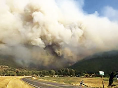 Smoke rises from the Carpenter Road Fire in Washington