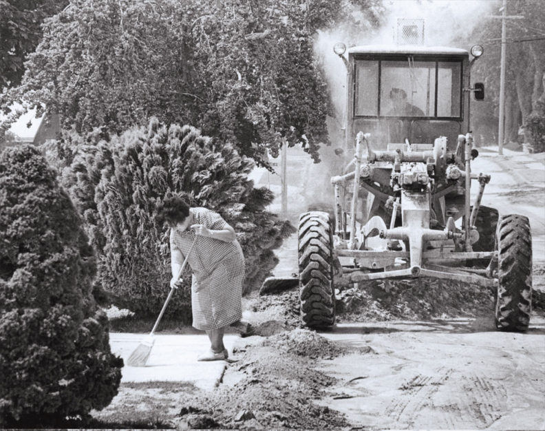 Woman sweeps ash in Ritzville after the eruption of Mount St. Helens