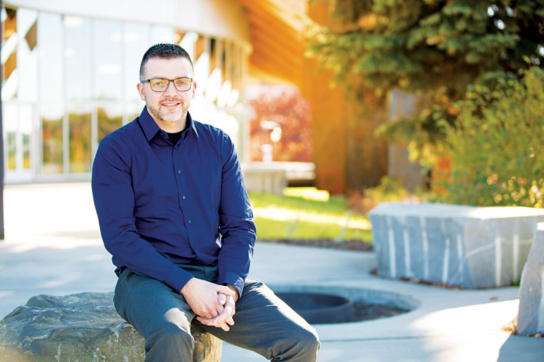 Barry Warren sits outside Elson S. Floyd Cultural Center at WSU