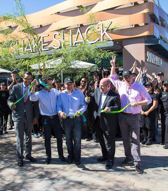 Shake Shack leaders in front of a store