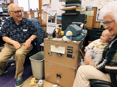 Duane and Arleen and great-grandson Archer at store office, 2020