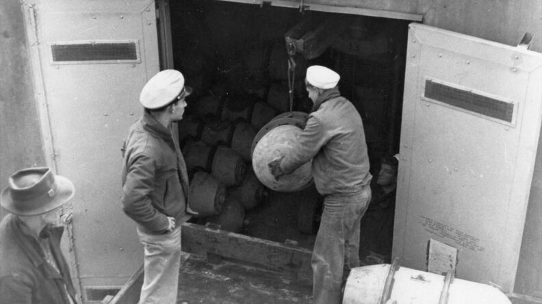Navy soldiers storing ordnance at Indian Island