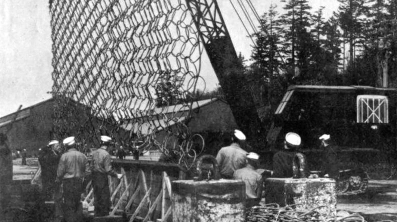 Crane lifts naval net