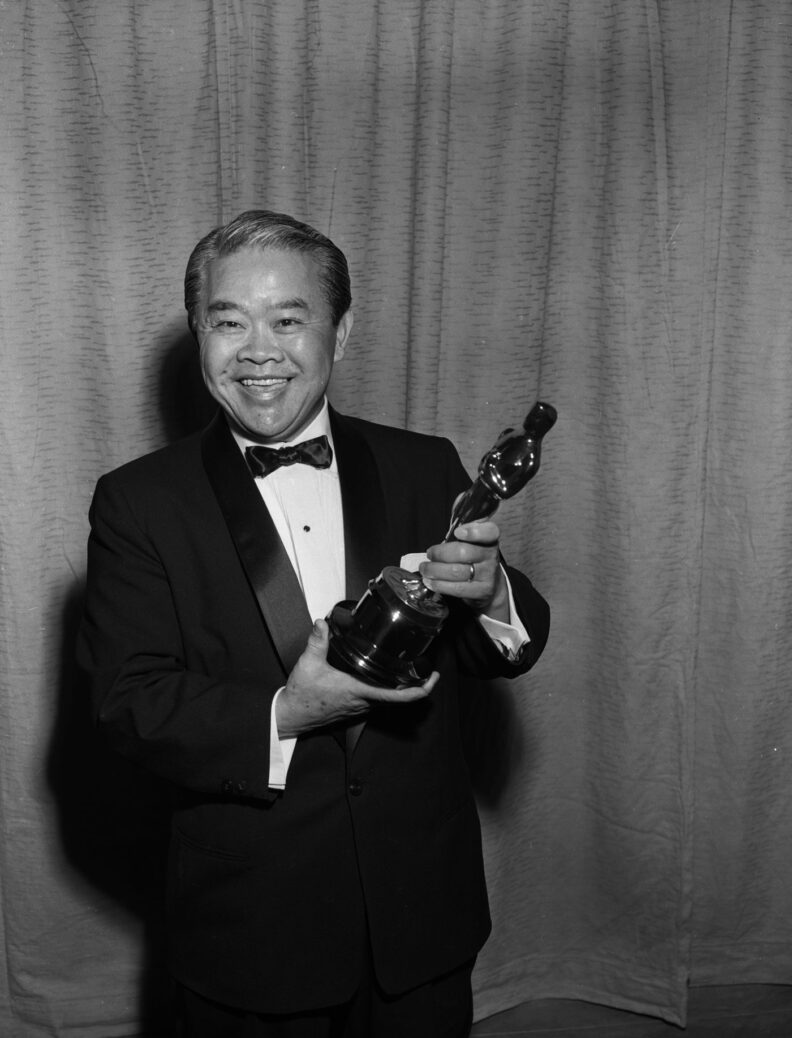 James Wong Howe with his Oscar for cinematography in 1956