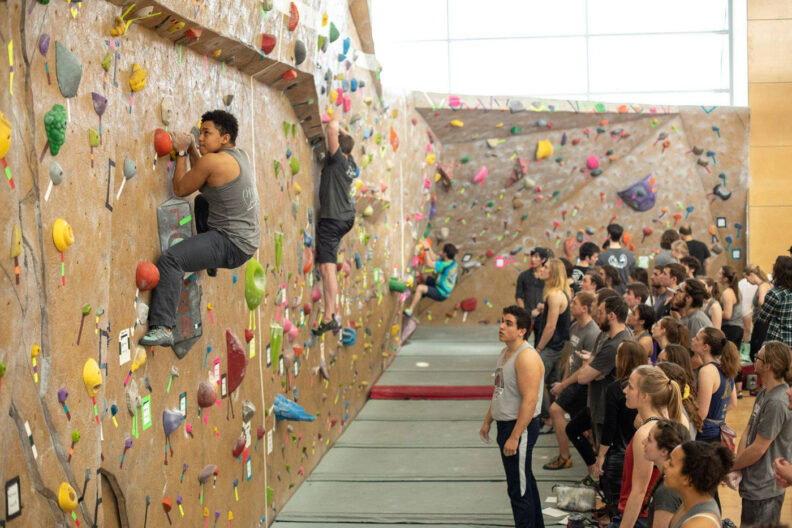 College students at Washington State University scale the climbing wall at the Outdoor Recreation Center
