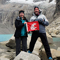 Diane and Phil Ohl carry a WSU Cougar flag in Patagonia
