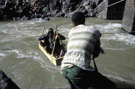 Men struggle to pull up passengers on temporary gondola
