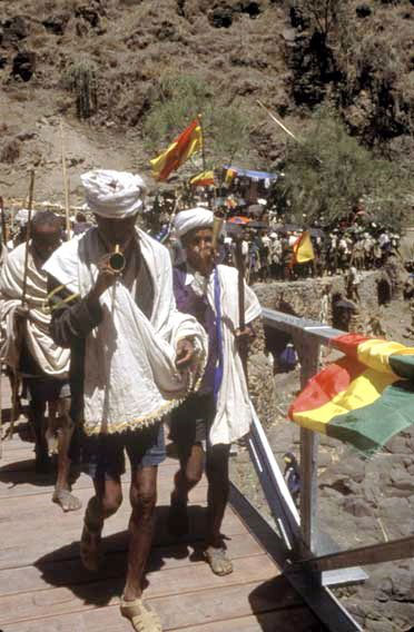 village leaders blow trumpets