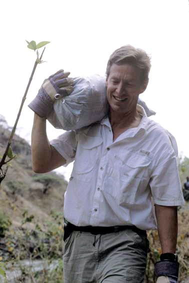 Ken Frantz carries a bag of gravel