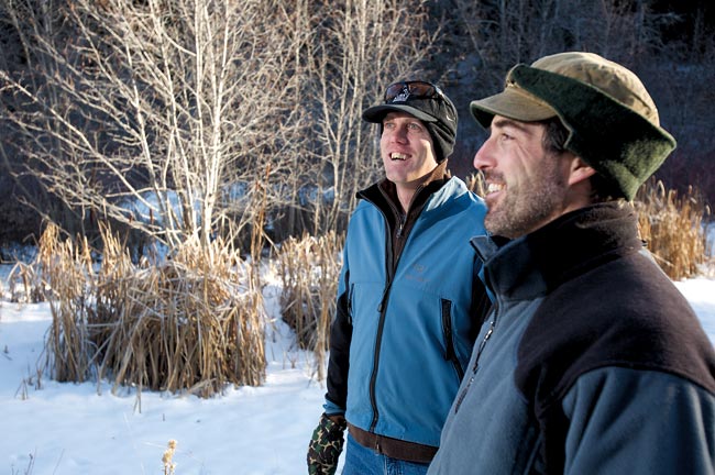 Ryan Anderson ’08 and Steve Bondi ’02 look over a beaver pond complex