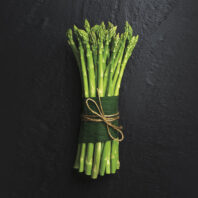 Asparagus bundle on a black background