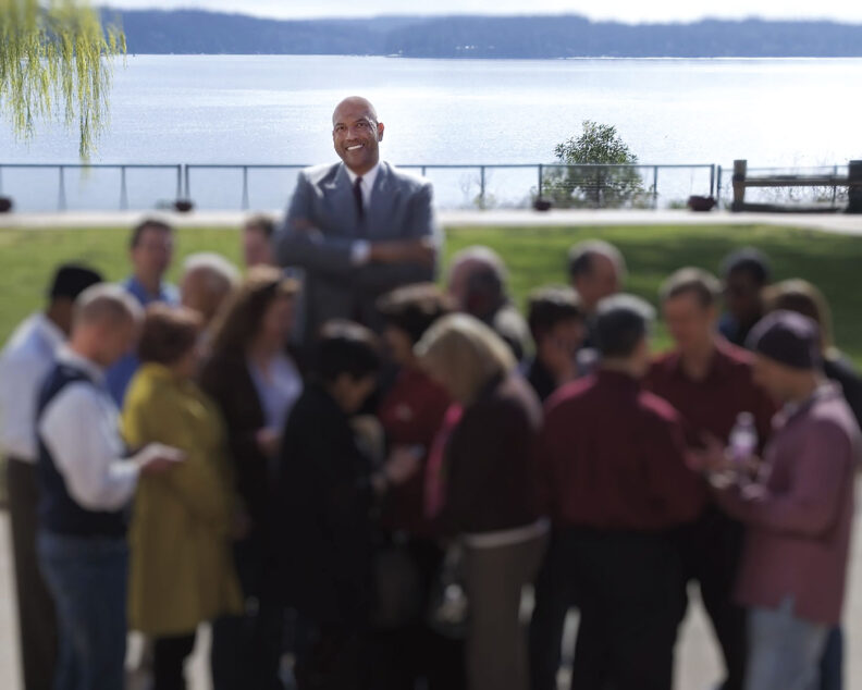 James Donaldson stands in a park in front of ocean