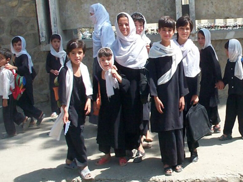 Afghani children stand outside a shop in Kabul in 2003