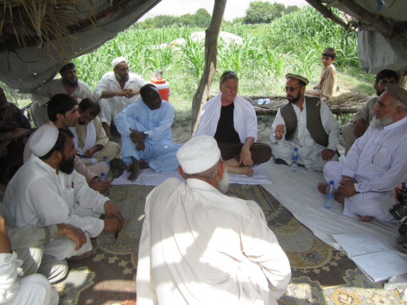 Group of men meeting in Afghanistan under a tent