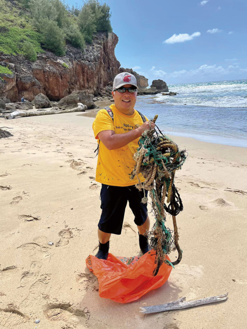 Nishimoto at a Kauai beach cleanup