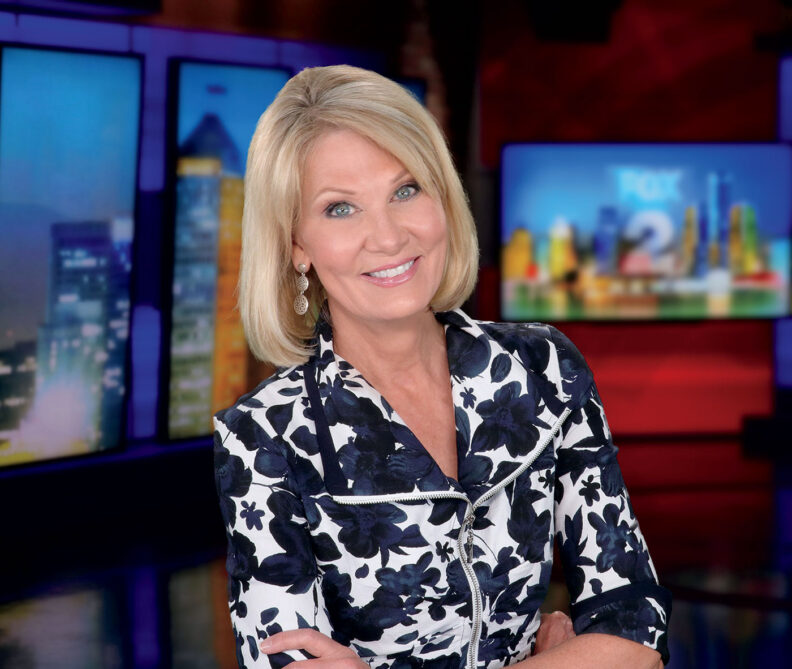 TV anchor Monica Gayle in front of Detroit FOX 2 backdrop