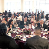 Large group of people in formal wear at a banquet on Washington State University campus