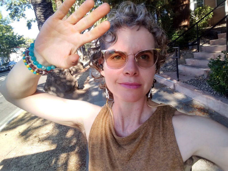 Margaret France holds up her hand