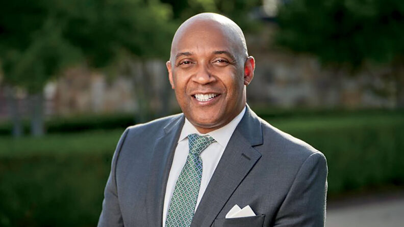 Bennie L. Harris in gray suit and blue-green tie