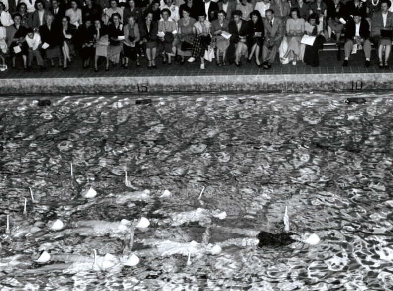 Black and white image of synchronized swimming performance at Washington State College in 1951