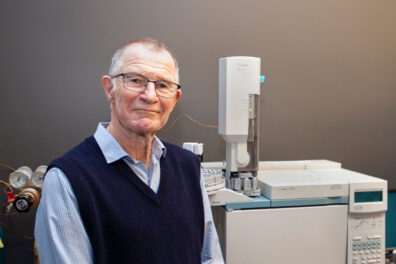 John Browse in front of lab equipment