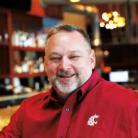 Anthony Anton sits at the bar in a restaurant