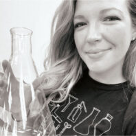 Chemistry teacher Johanna Brown holds a flask