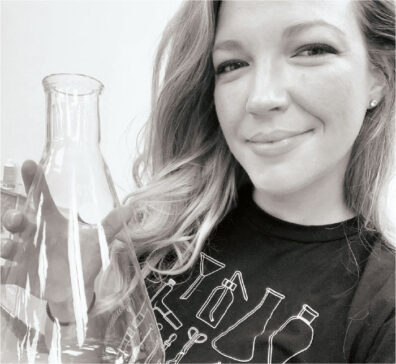 Chemistry teacher Johanna Brown holds a flask