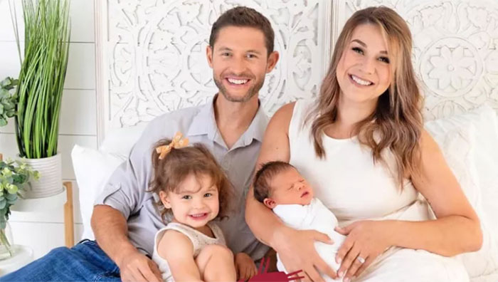 Andrea Perry wither her two young children and husband