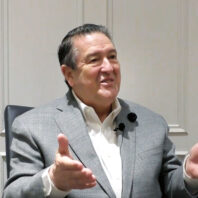 Donald Wood talking, hands outstretched