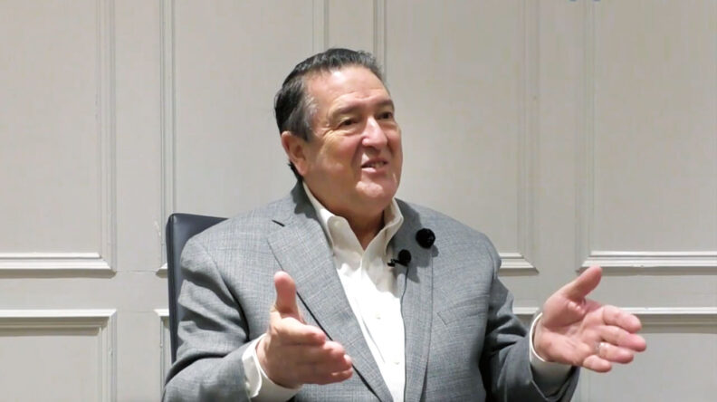 Donald Wood talking, hands outstretched