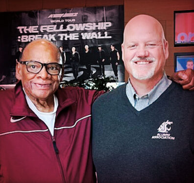 Closeup of George Raveling and Mark Schuster in WSU gear