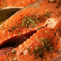 Closeup of wild Alaskan king salmon steaks in olive oil