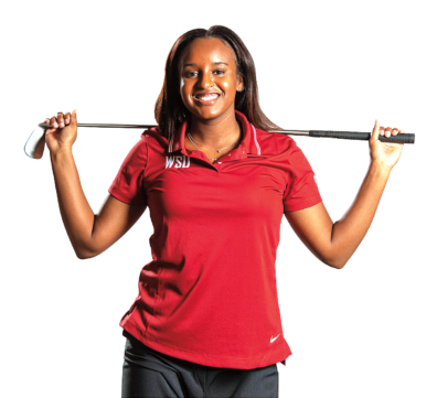 Cami March in a WSU polo shirt holding a golf club
