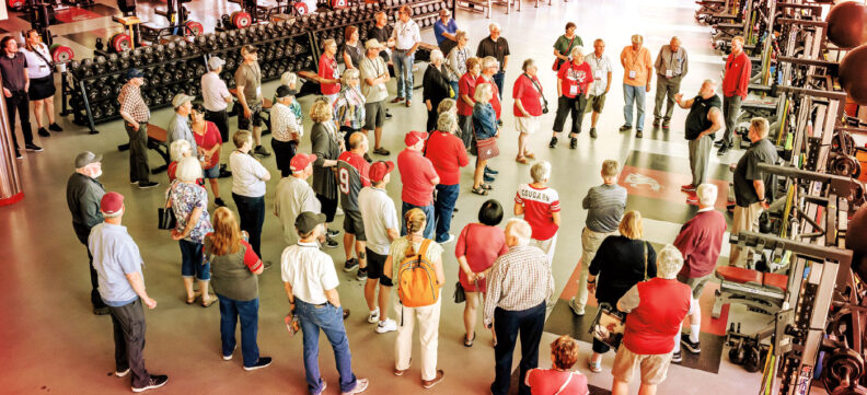 Group of Washington State University alumni tour the WSU weight room