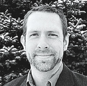 headshot of Chris Duke in black and white