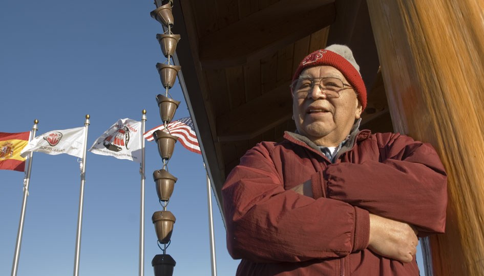 Claplanhoo stands in front of the memorial to Makah veterans