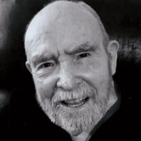 Profile of David Stratton in black and white