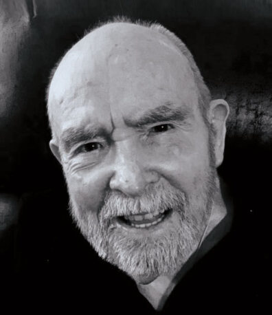 Profile of David Stratton in black and white