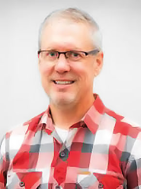 Profile of Greg Selstead in a flannel shirt